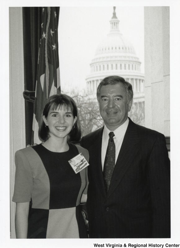 On the right, Representative Nick J. Rahall (D-W.Va.) stands for a photograph in his office with Sarah Lewis.