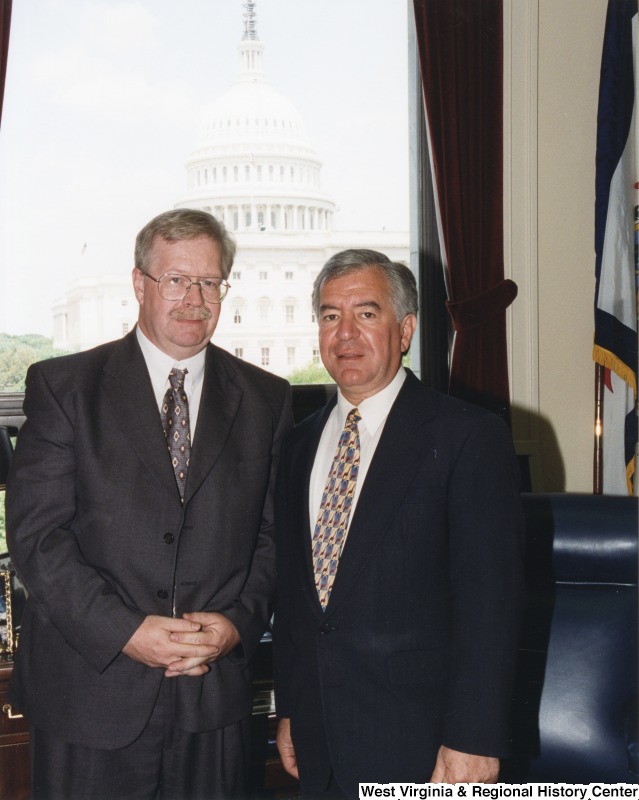 On the right, Representative Nick J. Rahall (D-W.Va.) stands for a photograph in his office with Mike Mitchem, director of Coalfields Expressway.