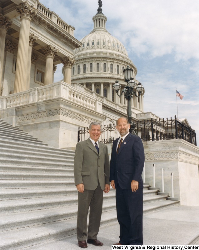 On the left, Representative Nick J. Rahall (D-W.Va.) stands for a photograph in front of the Capitol with Jerry Workman of Madison, WV, a national finalist for Teacher of the Year In Health Physical Education.