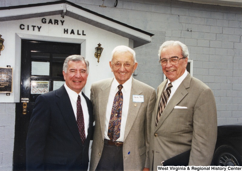 L-R: Representative Nick J. Rahall (D-W.Va.), Henry Paul, Governor of W.Va. Cecil H. UnderwoodThe three men stand for a photograph in front of the Gary City Hall.