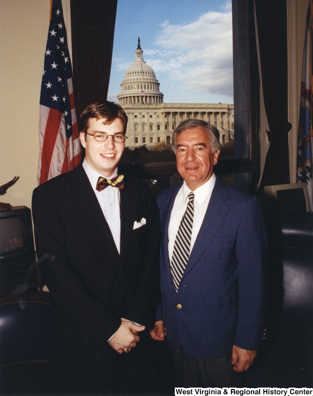 On the right, Representative Nick J. Rahall (D-W.Va.) stands for a photograph in his office with an unidentified man.