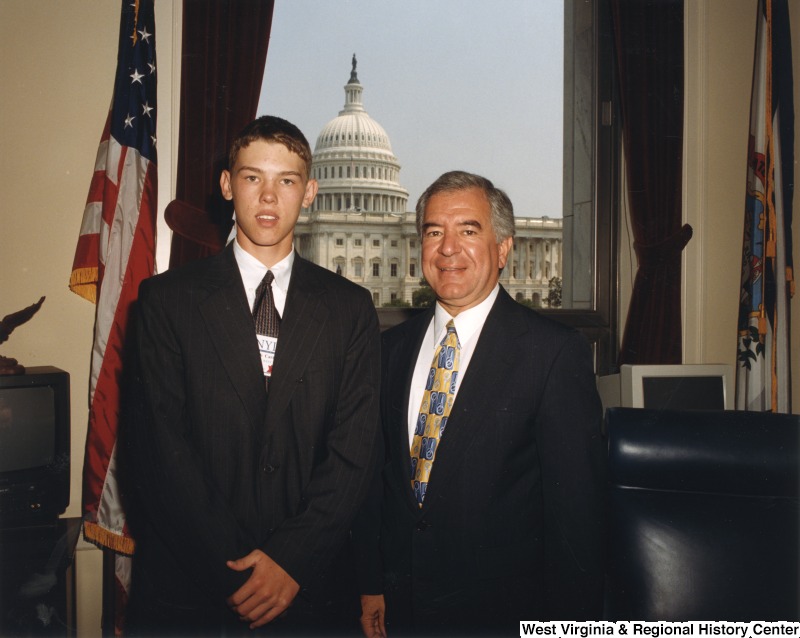 On the right, Representative Nick J. Rahall (D-W.Va) stands for a photograph with Zach Cavte in his office.