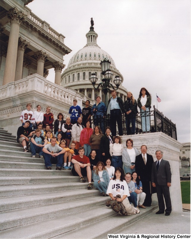 On the far right, Representative Nick J. Rahall (D-W.Va.) stands in front of the Capitol building with students from Webster Springs Junior High School.