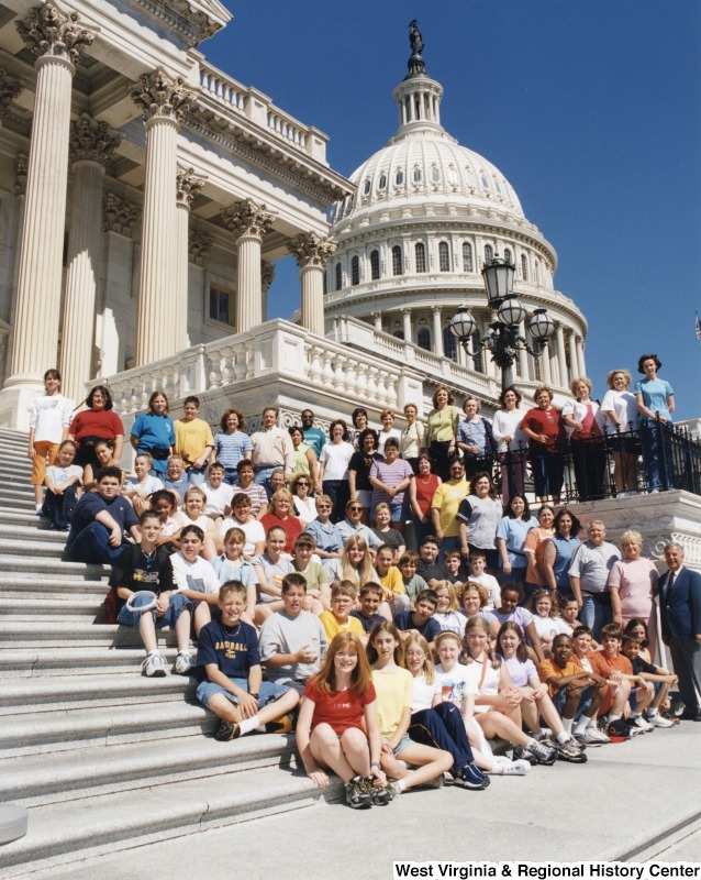 On the far right, Representative Nick J. Rahall (D-W.Va.) stands in front of the Capitol building with students from Logan Middle School.