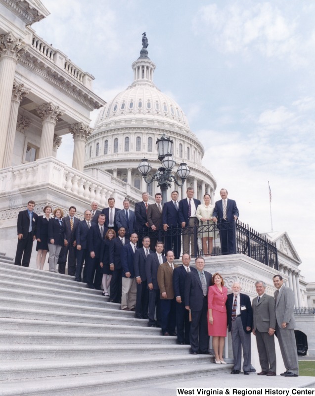 On the far right, Representative Nick J. Rahall (D-W.Va.) stands in front of the Capitol building with a group of people from Ashland Oil.