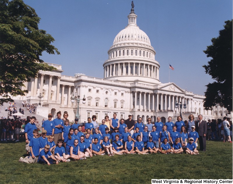 On the far right, Representative Nick J. Rahall (D-W.Va.) stands in front of the Capitol building with a group of students from Lewisburg Elementary School.