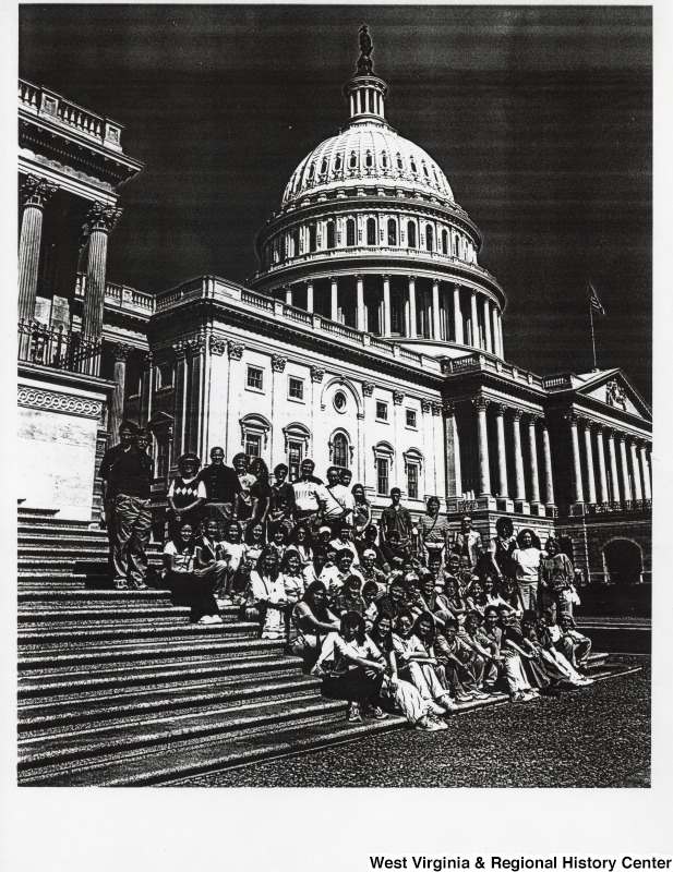 A group of students from St Joseph Catholic High School sit for a photograph in front of the Capitol building.